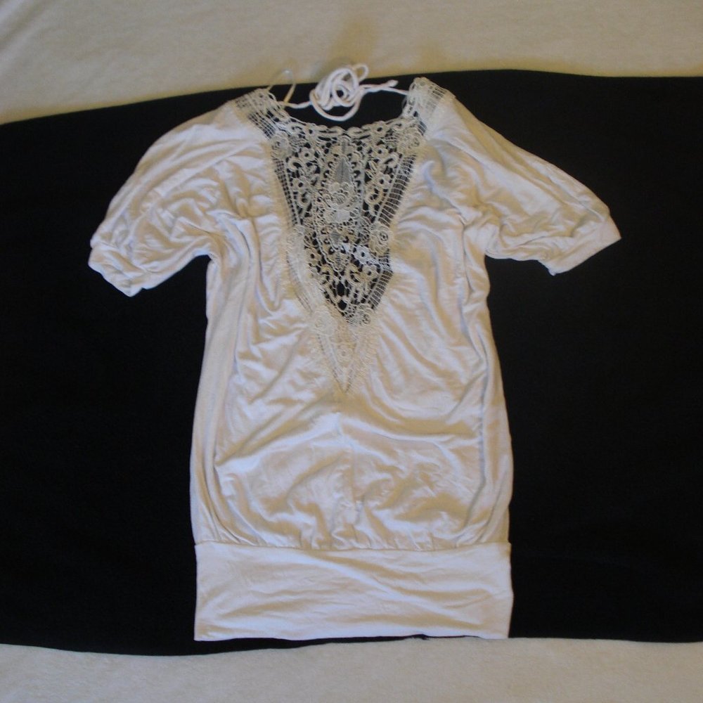 Seductive top with embroidery, tie and open back